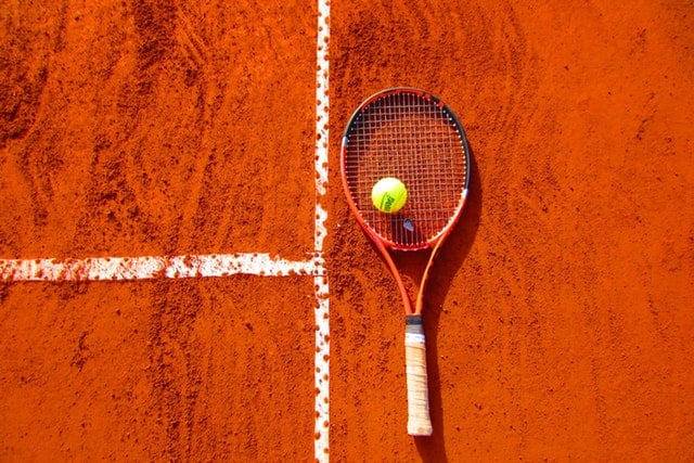 tennis racket on court